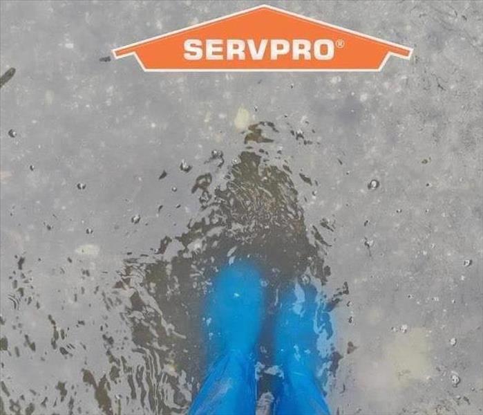 Water with blue boots in the puddle